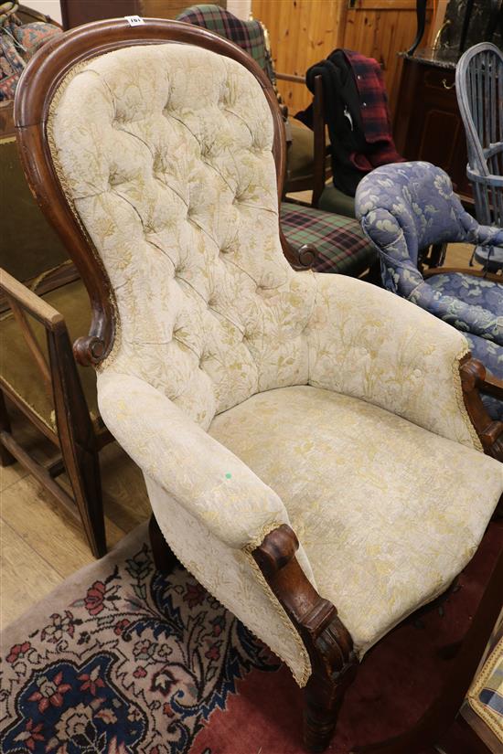 An early Victorian walnut show frame armchair